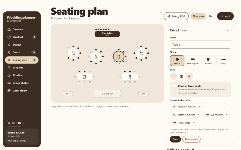 The seating plan on a computer: a floor plan with a top table, round and rectangular tables with chairs, bar, dance floor and DJ. Table 3 is selected, showing who sits there.